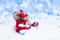 Baby playing with snow in winter. Royalty Free Stock Photo