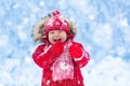 Baby playing with snow in winter. Royalty Free Stock Photo