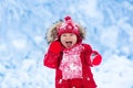 Baby playing with snow in winter. Royalty Free Stock Photo