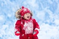 Baby playing with snow in winter. Royalty Free Stock Photo