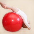 Baby playing sports with fitness ball. Royalty Free Stock Photo