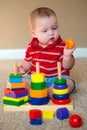 Baby playing with stacking learning toy Royalty Free Stock Photo