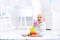 Baby playing with toy pyramid. Kids play Royalty Free Stock Photo