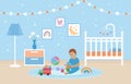 Baby playing with toys in bedroom. Nursery room interior. White crib with carousel for child. Decorations on wall and toys on Royalty Free Stock Photo