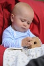 Baby playing with wooden toy