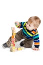 Baby playing with wooden toy cubes with letters. Wooden alphabet