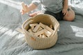 Baby playing with wooden toy. Kids hands holding a wooden blocks. Eco friendly, zero waste concept Royalty Free Stock Photo