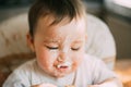 Baby portrait of a dirty stained cream meringue or cream