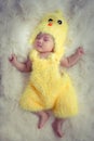 Baby portrait :Happy sleeping Asian baby wearing yellow rooster