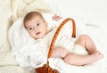 Baby portrait lie on white towel in bed, yellow toned Royalty Free Stock Photo