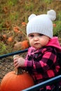 Baby in pumpkin patch wagon Royalty Free Stock Photo