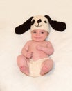 Baby with puppy hat and pants Royalty Free Stock Photo