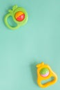 Baby rattle on green background Royalty Free Stock Photo