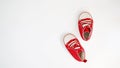 Baby red sneakers isolated on white background. baby shoes Royalty Free Stock Photo