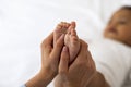 Baby Reflexology. Mother Massaging Tiny Feet Of Her Black Infant Child Royalty Free Stock Photo