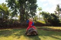 Baby riding giant turtle