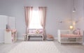 Baby room interior with comfortable crib Royalty Free Stock Photo