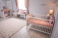 Baby room interior with comfortable crib Royalty Free Stock Photo