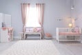 Baby room interior with comfortable crib Royalty Free Stock Photo