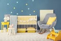 Baby room interior with crib and rocking chair Royalty Free Stock Photo