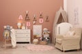 Baby room interior with furniture and crib Royalty Free Stock Photo