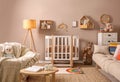 Baby room interior with stylish furniture and crib Royalty Free Stock Photo