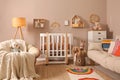 Baby room interior with stylish furniture and crib Royalty Free Stock Photo