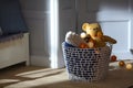Baby room with toy basket and teddy bear Royalty Free Stock Photo