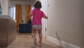 baby run along the corridor indoors. happy family kid dream concept. baby first steps playing run around at home Royalty Free Stock Photo