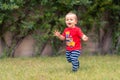 Baby running on green Royalty Free Stock Photo