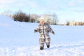 Baby running outdoors in winter