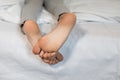 baby\'s bare feet on the bed close-up. Good morning. Pleasant dreams Royalty Free Stock Photo