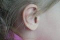 Baby`s ear close-up macro. Human anatomy. Symbol of hearing
