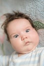 The baby`s eyes squint. Special problems with the baby s eyes. Myopia, astigmatism, cross-eyed Royalty Free Stock Photo