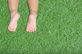 Baby's feet on artificial turf Royalty Free Stock Photo