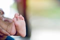 baby`s feet and father`s hands holding their feet with love and concern for their children Royalty Free Stock Photo