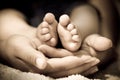 Baby's feet on mommys hand Royalty Free Stock Photo