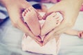 Baby`s feet in mother`s hand Royalty Free Stock Photo