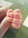 A babyÃÂ´s hand catching a manÃÂ´s finger