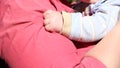 Baby`s hand with mom infant protection endearment