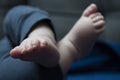 Baby`s little sweet feet on a blue background Royalty Free Stock Photo