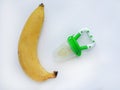 Baby`s nibbler and banana on white background. Organic baby food concept Royalty Free Stock Photo