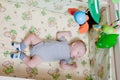 Baby`s restful sleep. Newborn baby in a wooden crib. The baby sleeps in the bedside cradle. Safe living together in a bedside cot Royalty Free Stock Photo