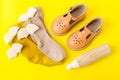 Baby sandals and wooden eco toy, baby`s first shoes Royalty Free Stock Photo