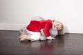 Baby santa claus embraced plush doll