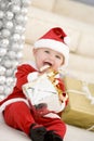 Baby In Santa Costume At Christmas