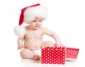 Baby in Santa hat with Christmas gift box isolated Royalty Free Stock Photo