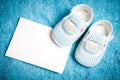 Baby shoes and empty postcard