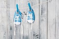 Baby shoes hanging on the clothesline. Royalty Free Stock Photo