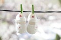 Baby shoes hanging on the clothesline Royalty Free Stock Photo